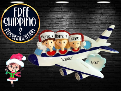 Blue-and-white airplane family ornament with three sample names against a dark brick display background.