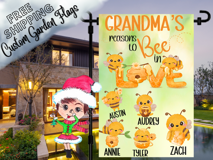 Grandma's reasons to bee in love garden flag mockup with named cartoon bees and honey-style Love lettering, shown at dusk.
