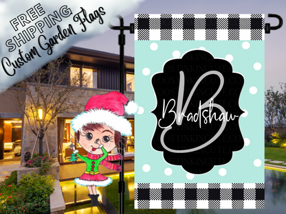 Mint polka-dot Bradshaw family garden flag with a script B monogram, black label and check borders shown at dusk.