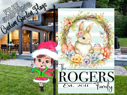 Rogers family garden flag with a flower-crowned bunny, pastel eggs and floral wreath, shown outside a house.