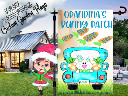 Grandma's Bunny Patch Easter flag with a smiling bunny, truck and named carrots, shown beside a white house.