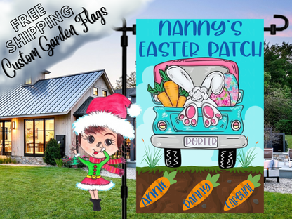 Nanny's Easter Patch garden flag with a turquoise truck, bunny feet and named carrots in soil beside a white house.