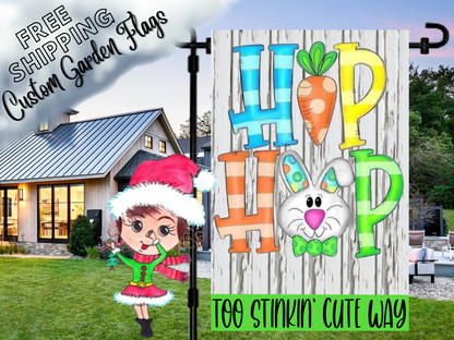 Hip Hop Easter flag with a carrot, bunny face and colorful letters, displayed beside a white house.
