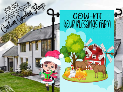 Cow-nt Your Blessings Farm garden flag mockup with cows, chickens, red barn and windmills in a daytime yard.