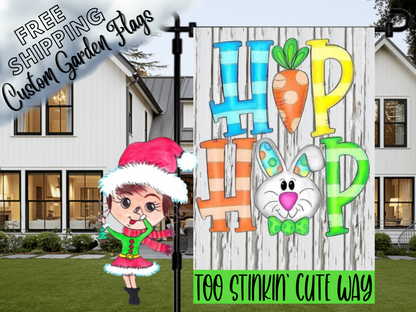 Hip Hop Easter flag with a carrot and bunny face on white wood print, displayed in front of a porch.