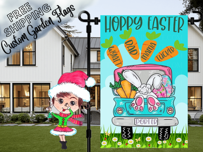 Happy Easter garden flag with a turquoise truck, bunny feet, eggs and named carrots, displayed in front of a porch.