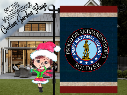 Proud Grandparents of a Soldier garden flag with an Army National Guard emblem, navy background and red and cream bands. Shown beside a front porch.