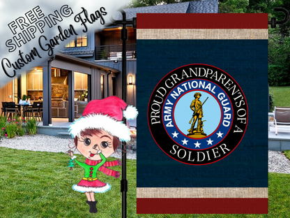 Proud Grandparents of a Soldier garden flag with an Army National Guard emblem, navy background and red and cream bands. Shown outside a house.