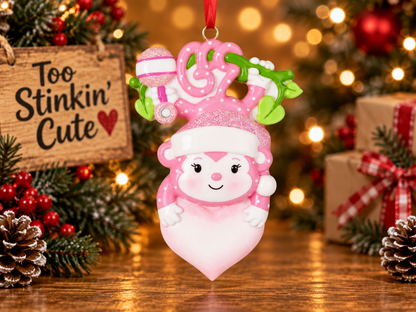Personalized baby girl First Christmas ornament with a custom name and pink design