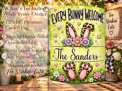 Whimsical Easter yard flag with bunny ears, pink paw pads, floral details, hearts, and a personalized family-name area.