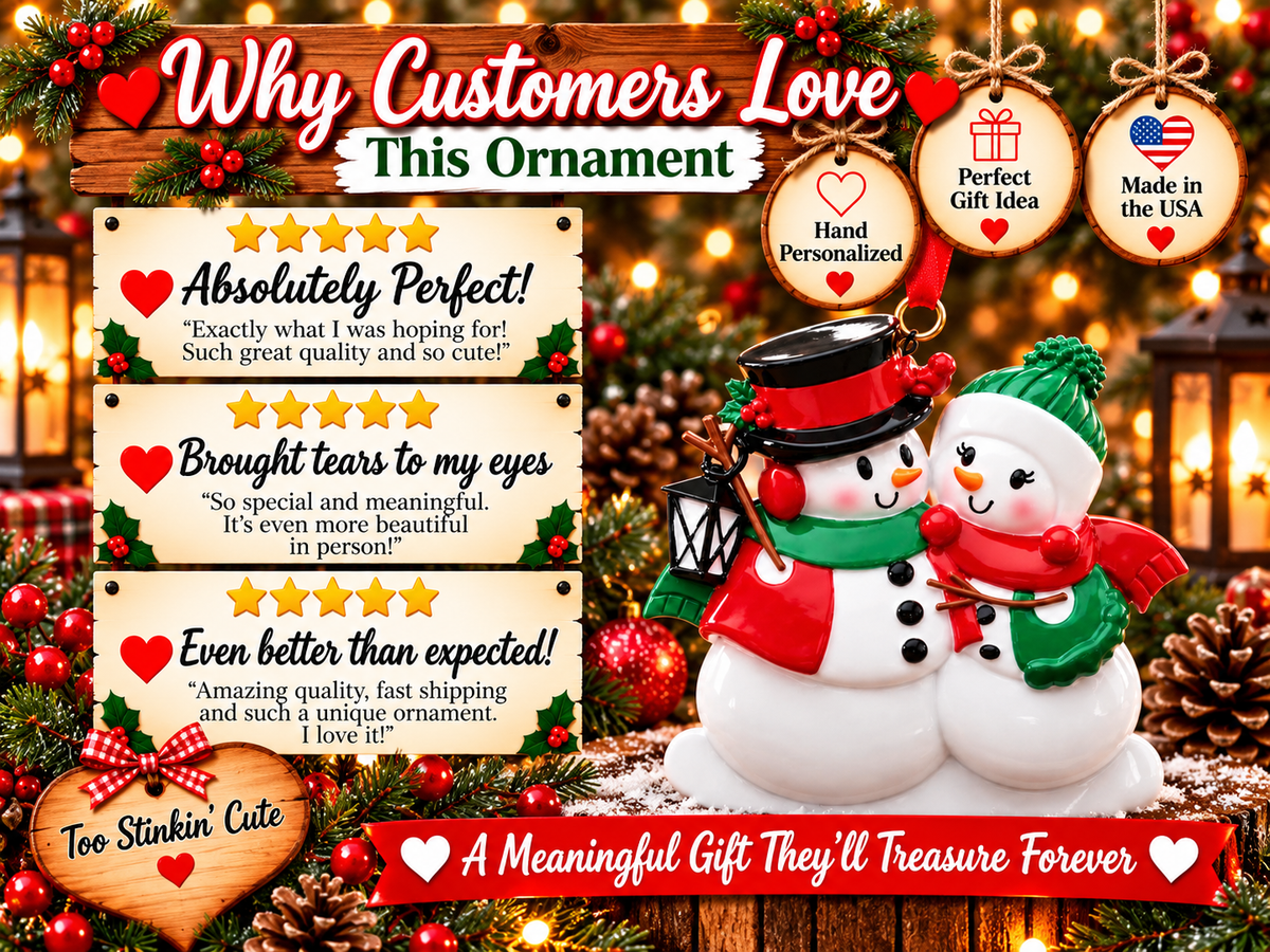 Snowman couple ornament with a small black lantern hanging beside the left snowman.