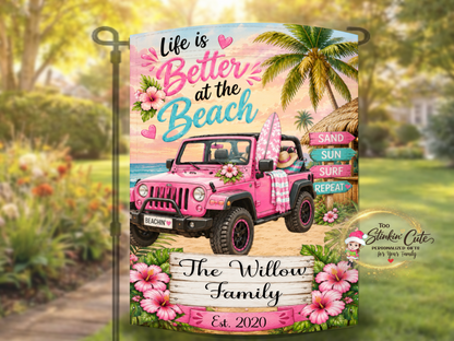 Tropical family yard flag with custom name and beach scene.