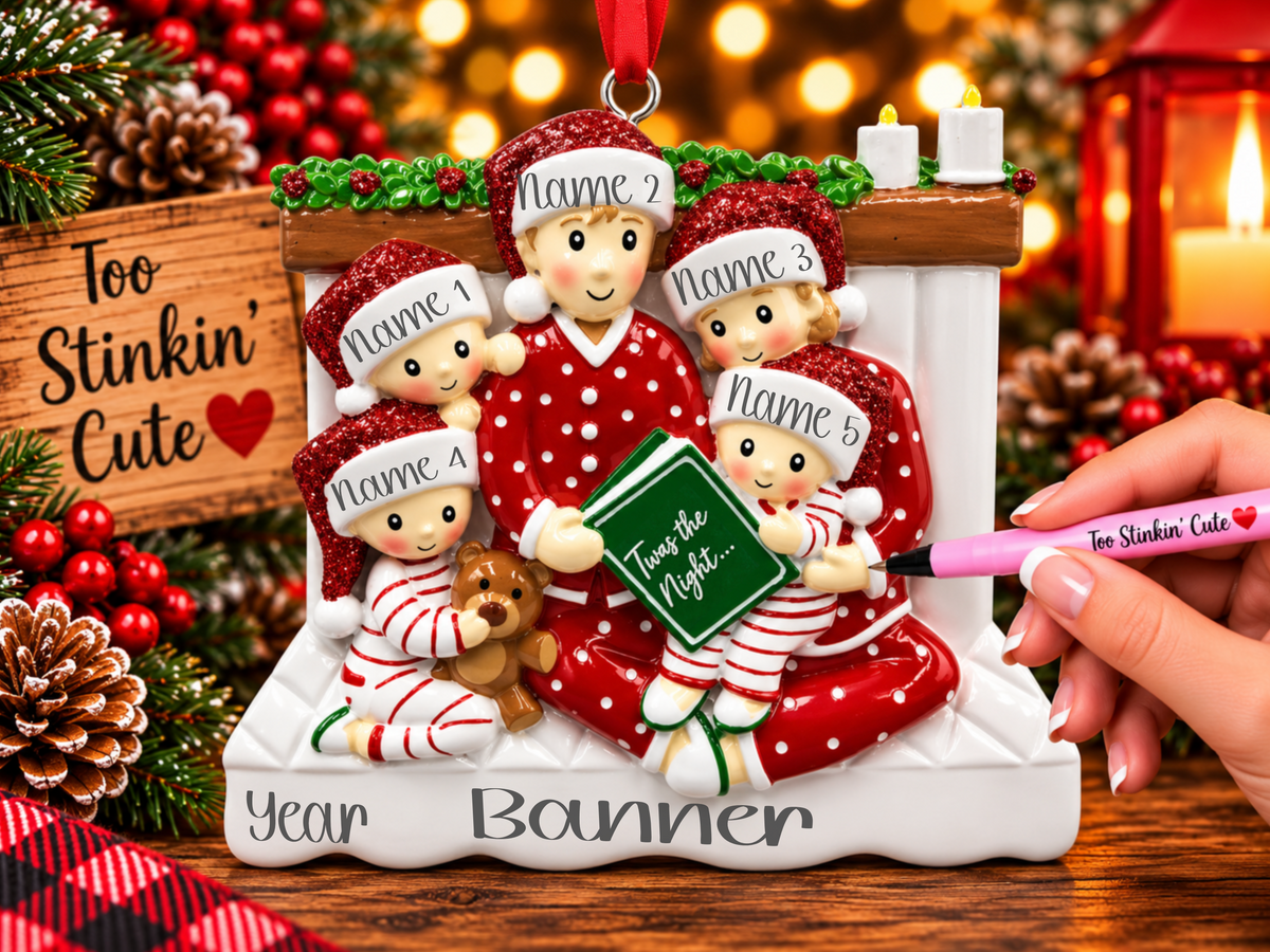 Parents wearing red polka-dot pajamas with three children in coordinating red and white holiday pajamas.