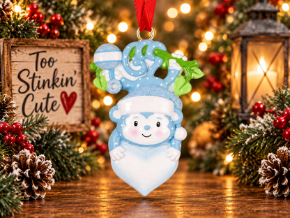 Personalized baby boy First Christmas ornament with a custom name and blue design