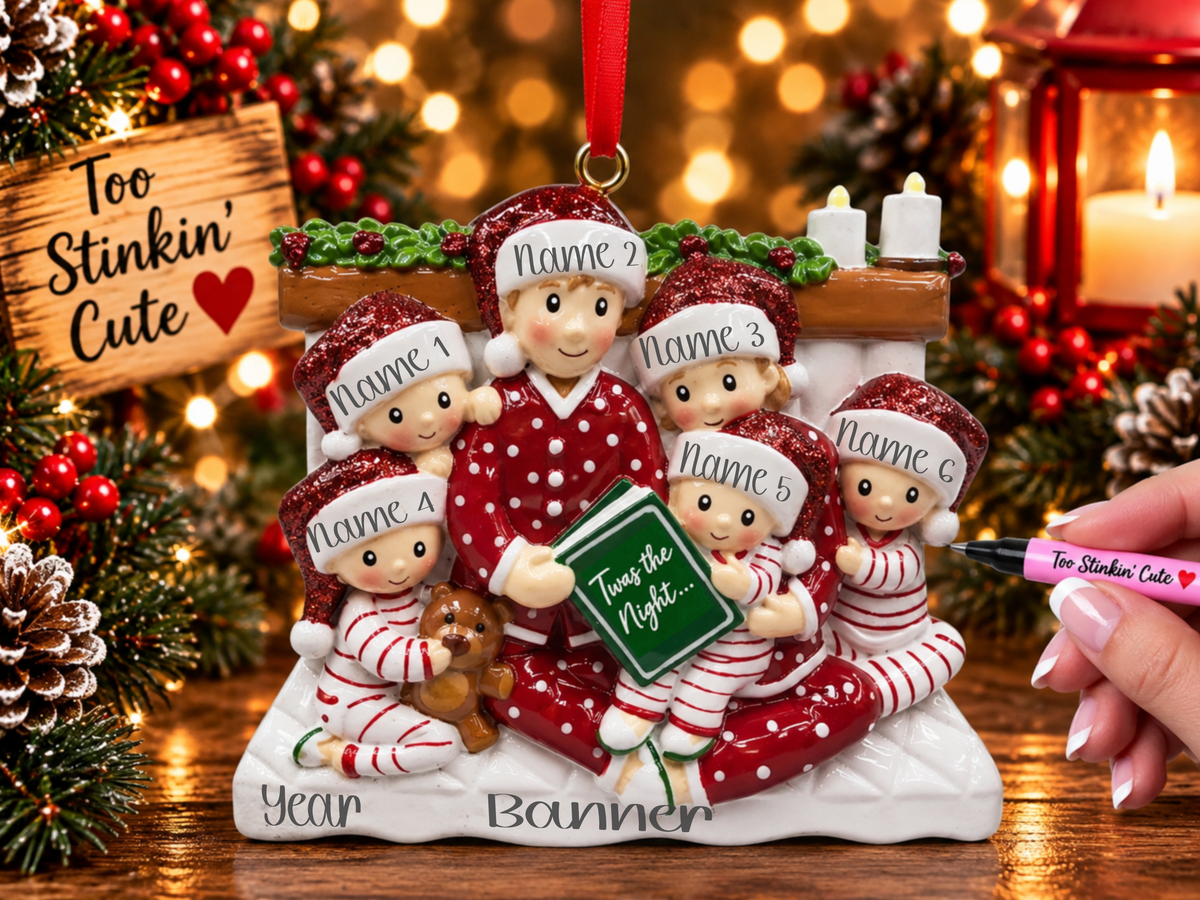 Family wearing red polka-dot and red and white striped pajamas with glittery red Santa hats.