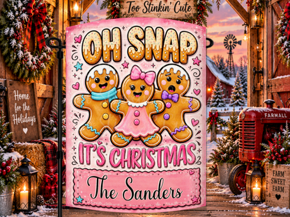 Personalized Oh Snap It’s Christmas garden flag featuring three colorful gingerbread characters, a bright pink background, and a custom family name plaque.