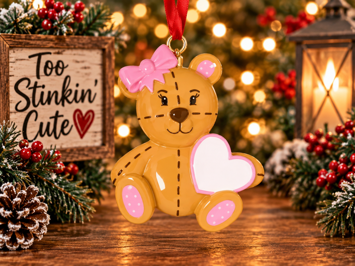 Personalized teddy bear Christmas ornament with a pink bow and custom name heart