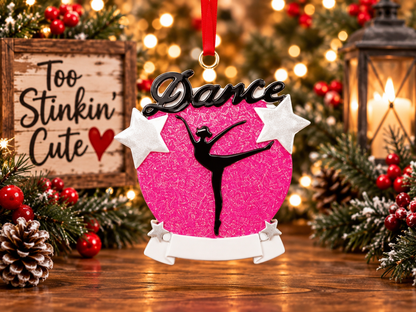 Dance-studio holiday gift with sparkling pink details and red hanging ribbon