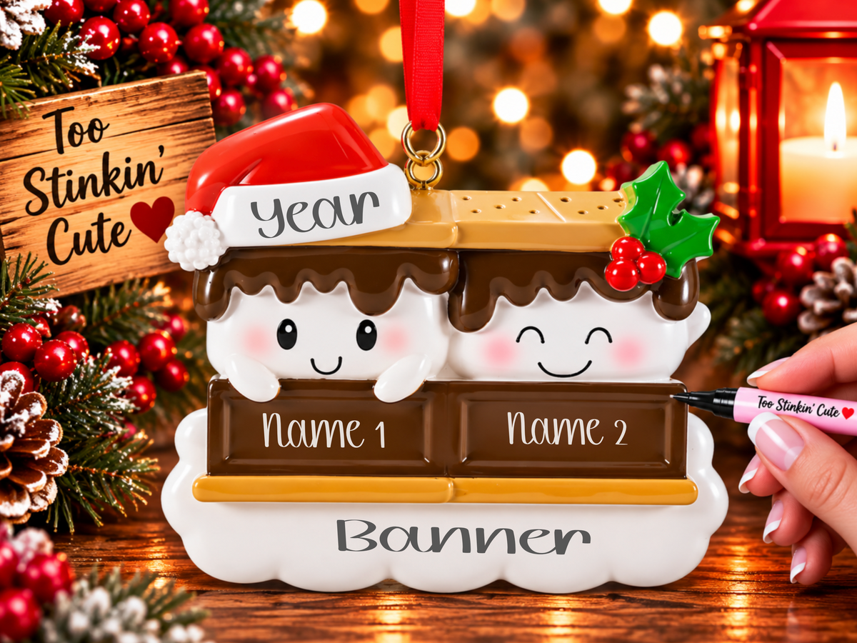 Two white marshmallows nestled between brown chocolate bars and golden graham crackers.