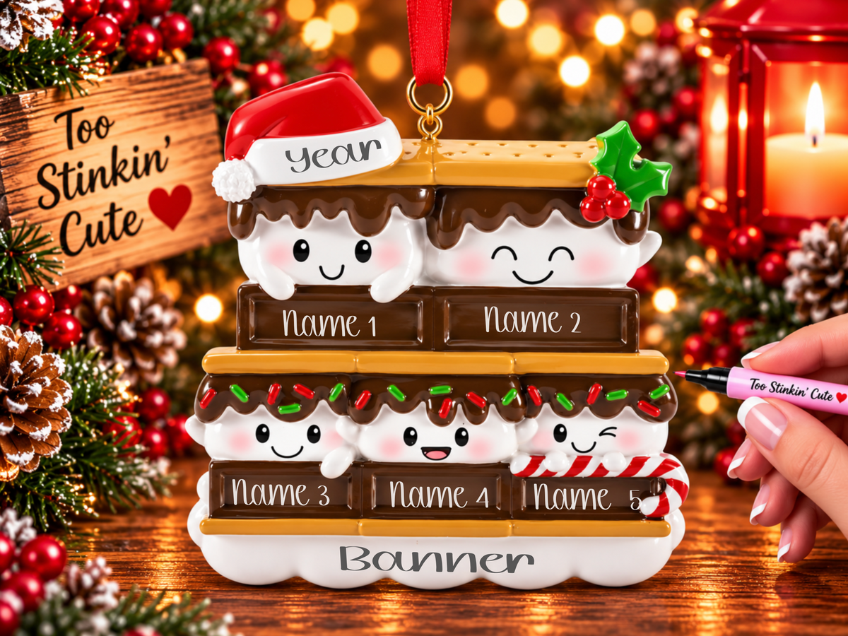 

Five smiling marshmallows nestled between brown chocolate bars and golden graham crackers.