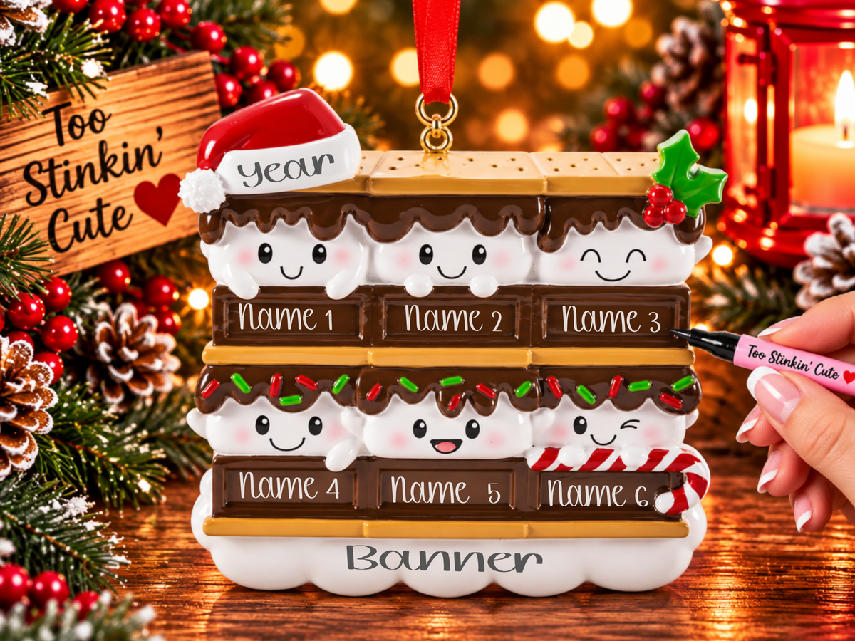 Six smiling marshmallows stacked between brown chocolate bars and golden graham crackers.
