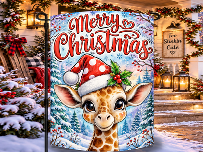 Merry Christmas garden flag featuring a cute giraffe wearing a red polka-dot Santa hat in a snowy evergreen forest.