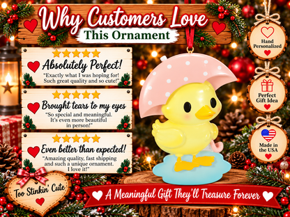 Yellow duck ornament hanging from a red ribbon with Christmas greenery and warm lights in the background.