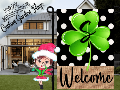 St. Patrick's Day welcome garden flag mockup with a green shamrock, black S monogram and white polka dots on black.