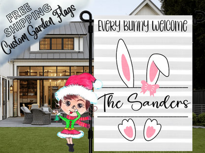 Gray striped Every Bunny Welcome garden flag mockup with bunny ears and feet, a pink bow and Sanders family name.