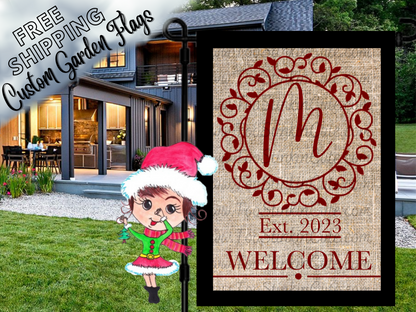 Burlap-look garden flag mockup with a red script monogram, ornate circular frame and welcome message.