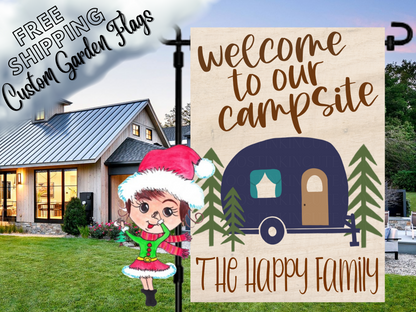 Welcome to our campsite garden flag mockup with a navy camper, pine trees and family-name lettering on a wood-look background.