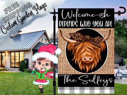 Highland cow garden flag mockup with a leopard-print bow, family name and Welcome-ish, depends who you are message.