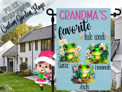 Grandma's favorite little toads garden flag mockup with named green frogs, flowers and a light blue background.