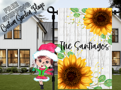 Garden flag mockup with yellow sunflowers, Santiago family name and a white wood-print background.