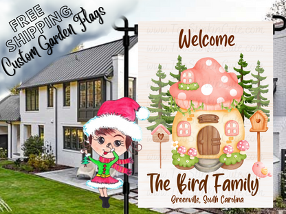 Welcome garden flag mockup with a pink mushroom cottage, birdhouses, pine trees and Bird family-name lettering.
