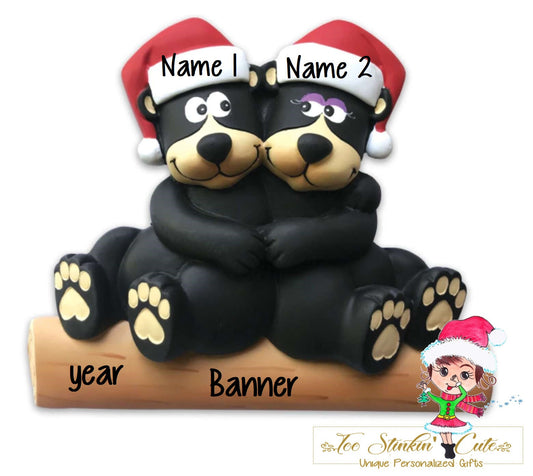 Family of 2 table topper with black bears cuddled together on a log. Sample personalization labels are shown.