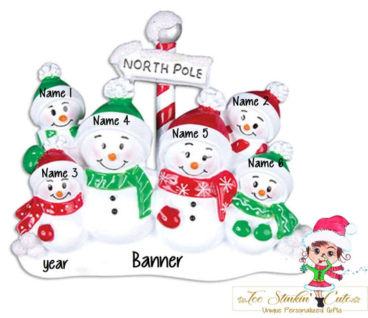 Family of 6 table topper with snowmen gathered around a striped North Pole sign. Sample personalization labels are shown.