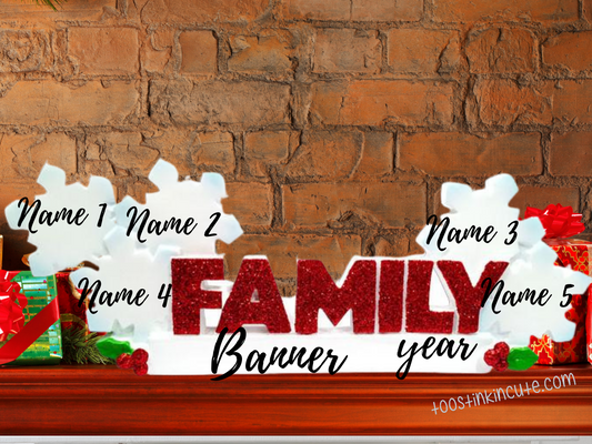 Family of 5 table topper with white snowflakes above glittery red FAMILY lettering. Sample personalization labels are shown.